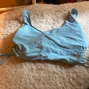 A light blue bathing suit top